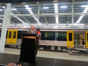 Mayor Len Brown with his grandson Luke reveal the new electric trains
